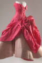 Side view of pink ballgown showing two layer skirt created by shocking pink bodice and sculpted…