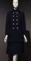 Navy blue military uniform style ensemble of coat with five pairs of gold buttons and knee leng…