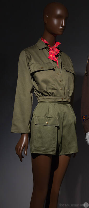 close up of army green button down with red neck scarf styled with matching green shorts
