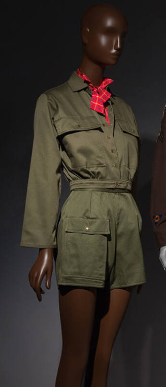 close up of army green button down with red neck scarf styled with matching green shorts