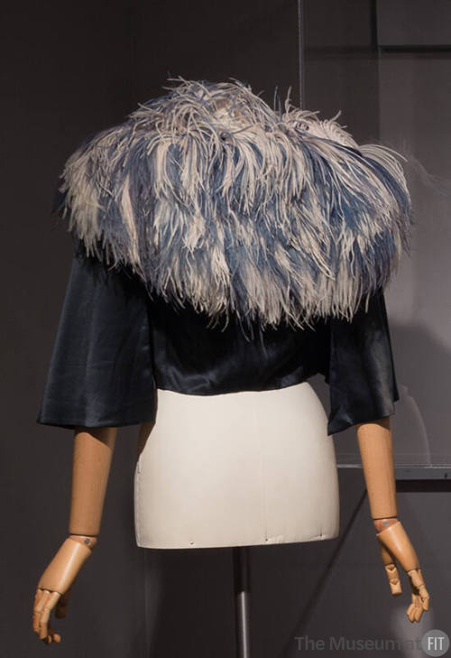 Blue bolero jacket with large blue ostrich feather collar