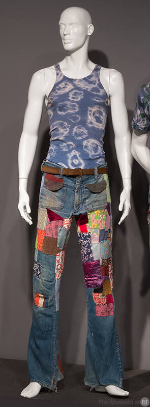 Blue and white tie dyed tank top and multicolor patched jeans 