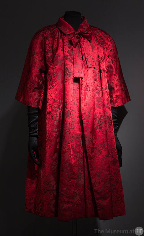 Red and black floral evening coat with elbow length sleeves and roll collar 