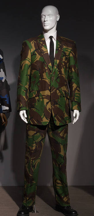 Man's single breasted jacket and pants in green, khaki, black and brown camouflage print