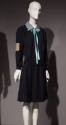 Navy blue uniform dress with long sleeves, light blue collar with aqua blue ribbon bow tied at …
