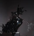 Alternate view of black and grey acrylic splash dress on a black pedestal 