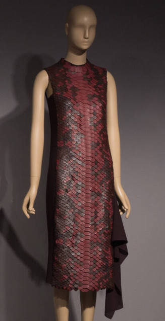 Sleeveless below the knee dress with red and brown scale-shaped cutouts in snake skin pattern