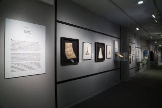 Pockets to Purses: Fashion + Function installation view of the gallery with objects in cases an…