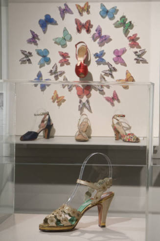 Scandal Sandals and Lady Slippers exhibition installation view of shoes in cases 