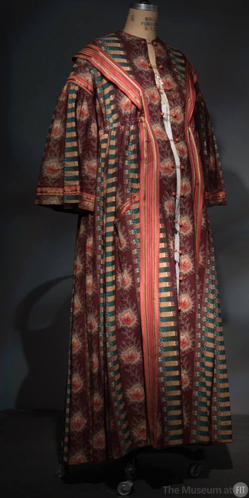Floor length robe with alternating vertical stripes of brown floral, green and gold stripes and…