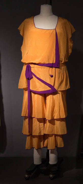 Square-necked orange pajama set of tunic with square neck and contrasting purple trim with matc…