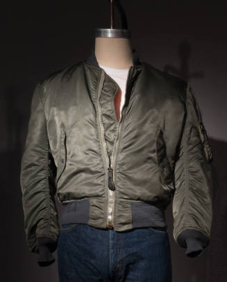 Green nylon zip front flight jacket with sanp pockets and ribbed collar and cuffs
