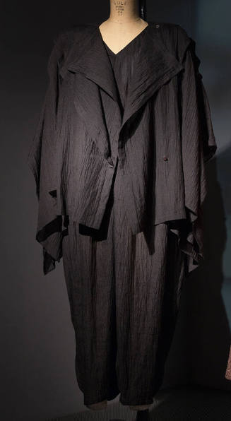 Black crinkle linen wide square tunic with open sleeve panels and draped front panels and match…