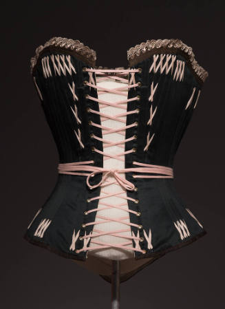 Black corset with pink lace top trim, pink lace closure and pink X stitches throughout