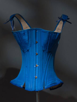 Vibrant blue boned corset with shoulder straps that tie in front