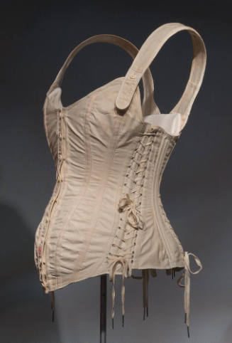 White maternity corset with front button closure, front shaped by princess seams and laced side…