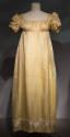 Yellow and white dobby weave floor length dress with ribbon trimmed puff sleeves, high empire w…