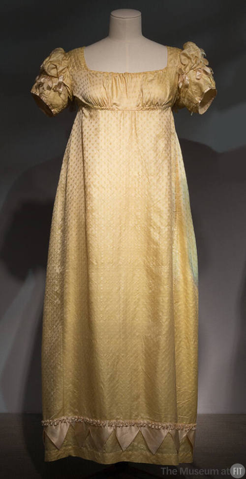 Yellow and white dobby weave floor length dress with ribbon trimmed puff sleeves, high empire w…