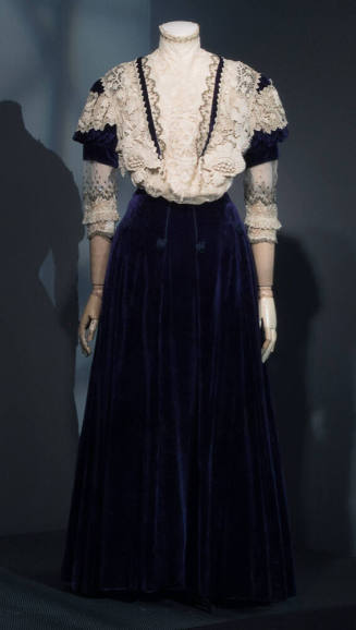 Two-piece blue velvet floor length dress with ivory crochet lace insets on bodice and ¾ length …
