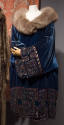 Deep teal blue knee length opera coat with gold metallic geometric border design, fur shawl col…