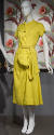 Yellow linen cap sleeve claf length dress with asymmetric button front, hip swag and matching b…