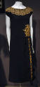 Black cap sleeve dress with wide lace collar, embroidered flowers at hip and down skirt ruffle 