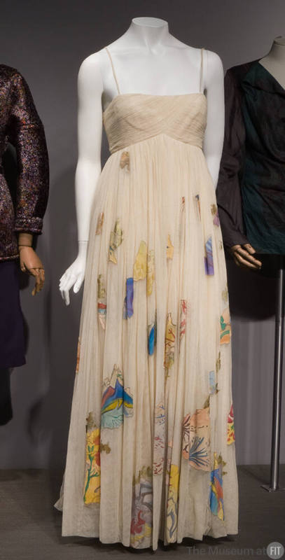 Off white floor length gown with multicolor abstract appliqué shapes hand painted with floral d…