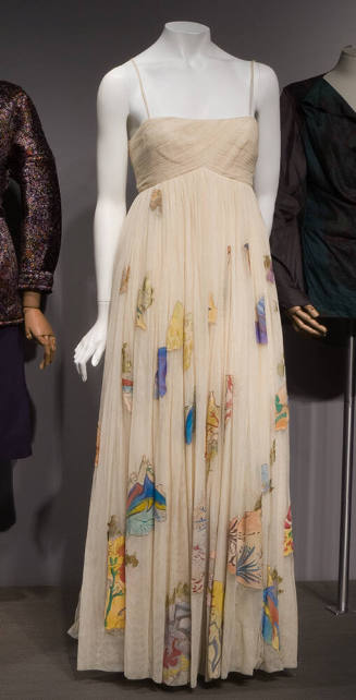 Off white floor length gown with multicolor abstract appliqué shapes hand painted with floral d…