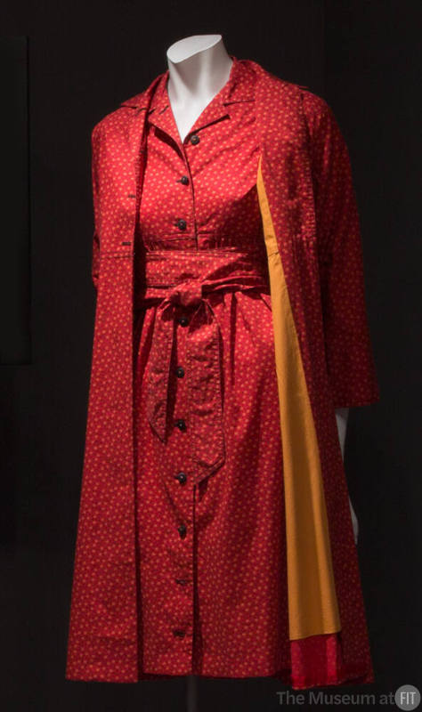 Red knee length dress and matching duster coat with orange and black calico print, button front…