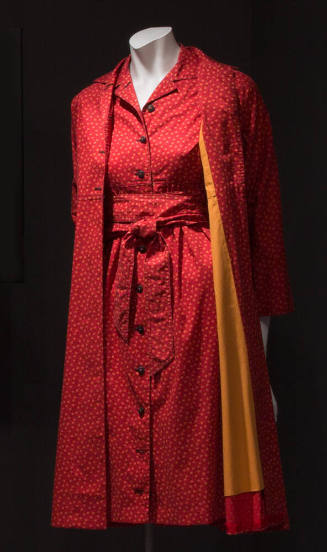 Red knee length dress and matching duster coat with orange and black calico print, button front…
