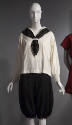Off-white long sleeve sailor top with black silk scarf through neck loop, black wool bloomers