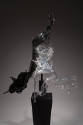 Alternate view of black and grey acrylic splash dress on a black pedestal 