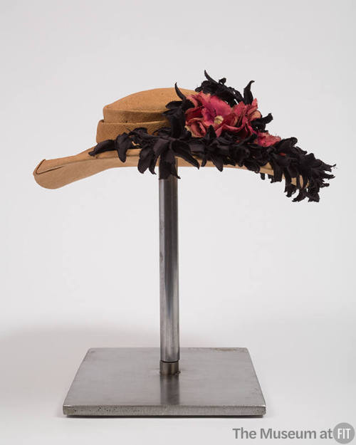 Panama straw hat decorated with black fabric flowers