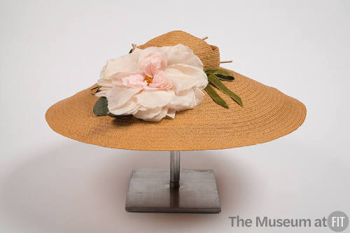 Tan straw hat with pink flower
