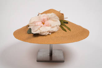 Tan straw hat with pink flower