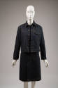 Dark blue denim button front jacket with yellow topstitching over matching knee length dress