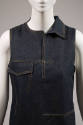 Detail view of dark blue denim dress showing yellow topstitching, single right side collar and …