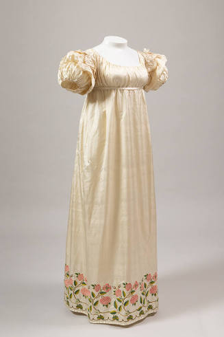 Off-white silk floor length dress with empire waist, short puff sleeves, hem with embroidered r…