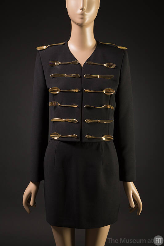Black wool long sleeve jacket embellished with 14 gold metal forks, spoons, and knives, matchin…