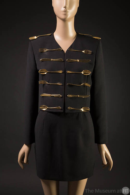 Black wool long sleeve jacket embellished with 14 gold metal forks, spoons, and knives, matchin…