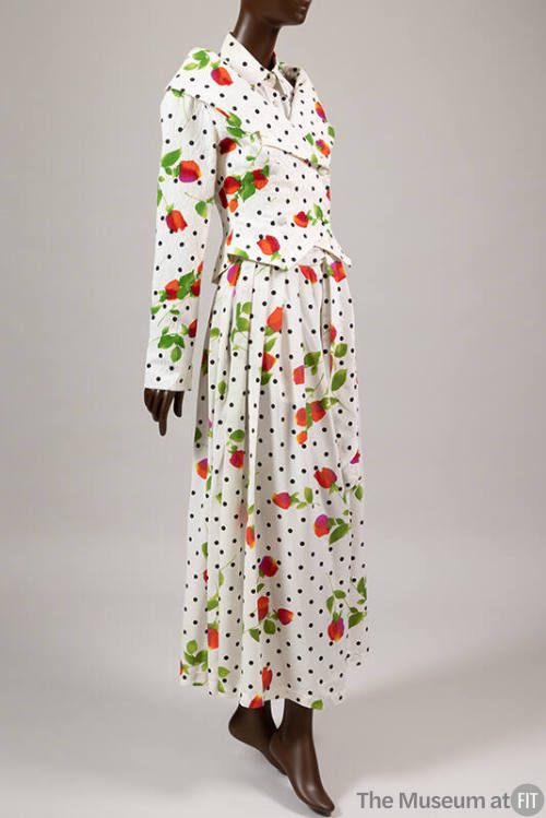 Orange, pink with green stem rose print and black polka dot pattern on white double breasted, l…