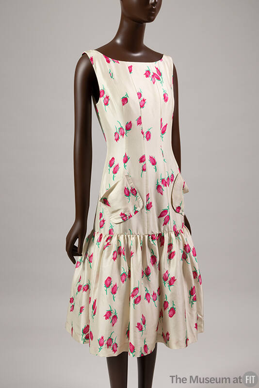 Off-white silk sleeveless below-the-knee dress with red rose print, patch pockets,  flounce ski…