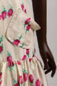 Detail of off-white silk with red rose print dress patch pocket 