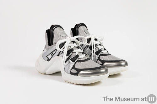 Silver mesh and leather sneakers with black trim, white laces and soles