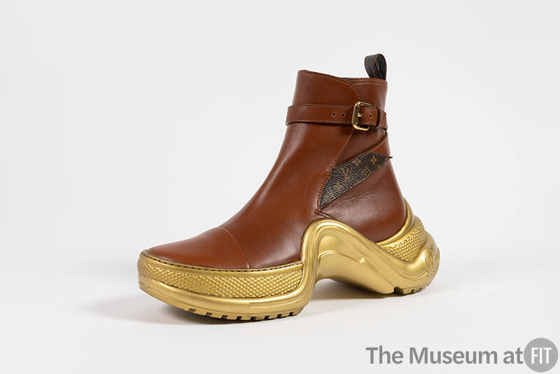 Brown leather ankle sneaker boot with gold sole, ankle buckle strap