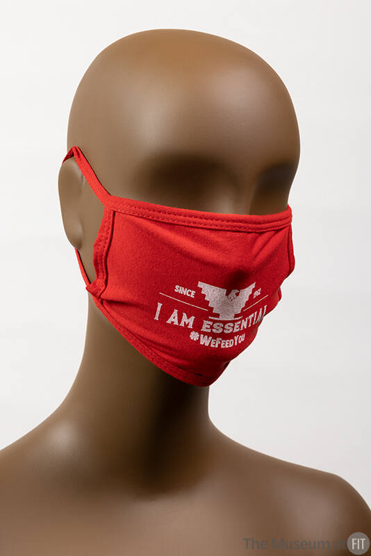 Red face mask with white text: I Am Essential and #wefeedyou