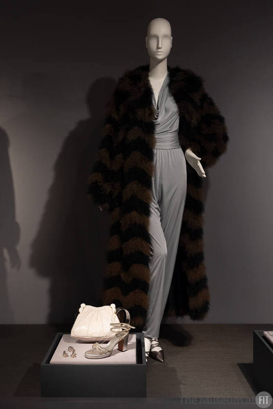 James Daugherty evening set, circa 1971 and Christian Dior feather coat, circa 1972 with accessories by Judith Leiber, Elsa Peretti, and David Evins, 1971-1975