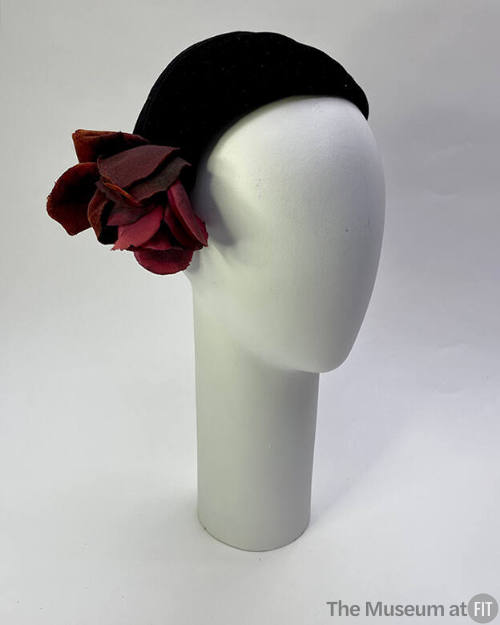 Black demi calot hat; red fabric rose on side