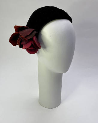 Black demi calot hat; red fabric rose on side