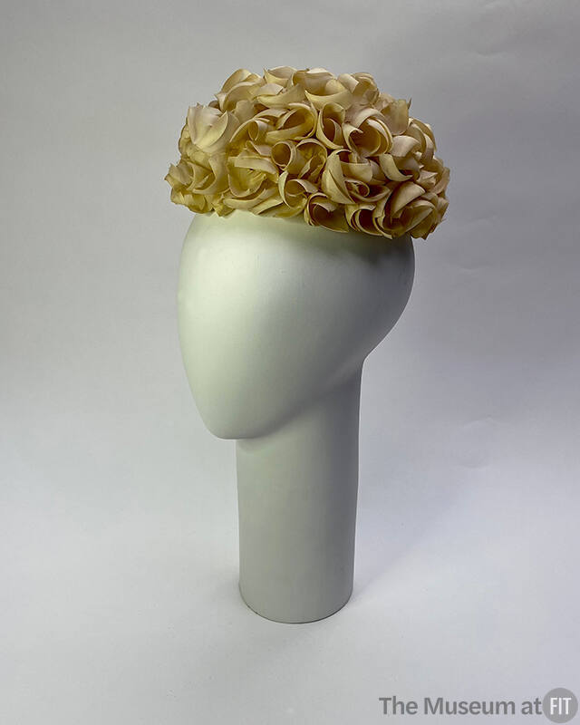 White net beret covered in white silk flower petals